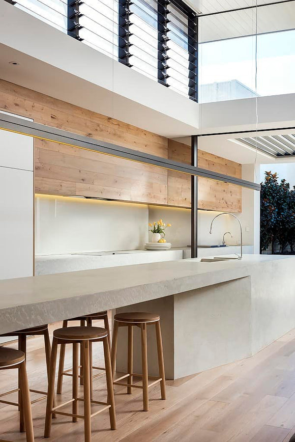 Crop Bar stools featured in this beautiful formed concrete kitchen.