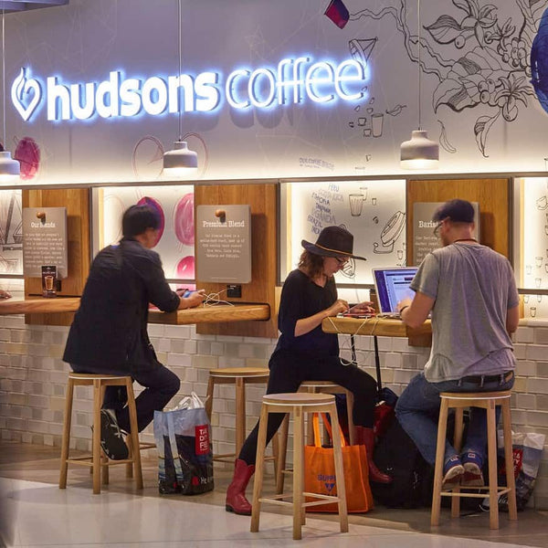 Solid Oak Crop Bar Stools designed by Relm Furniture featured in the new Hudsons Coffee store at Sydney International Airport